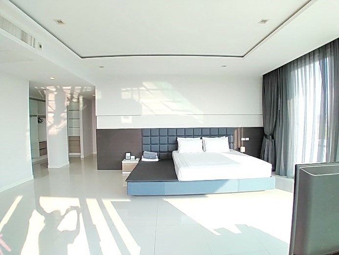 House for sale East Pattaya showing the master bedroom with walk-in wardrobes 