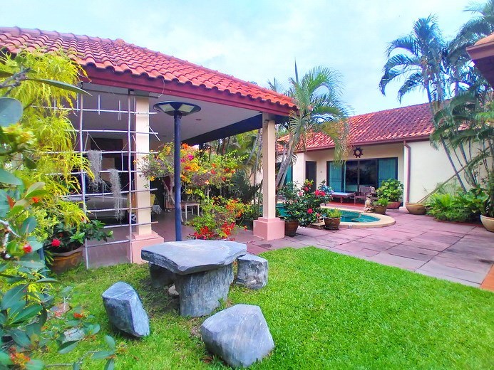 House for sale Huay Yai Pattaya showing the carport and garden House for sale Huay Yai Pattaya showing the carport and garden