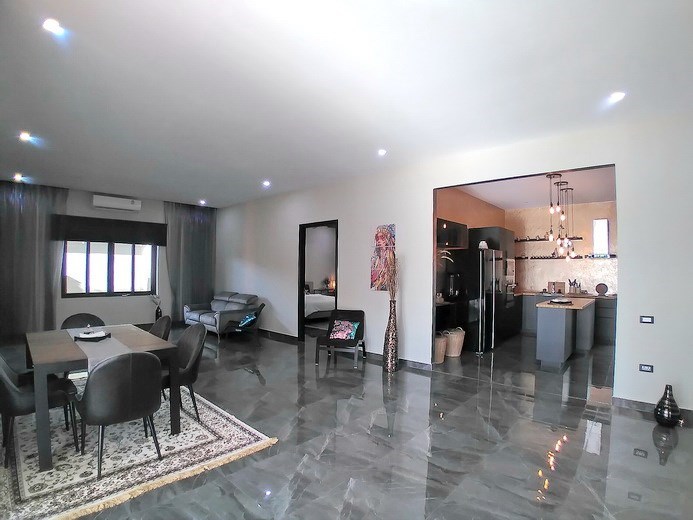 House for sale Huay Yai Pattaya showing the living, dining and kitchen areas 