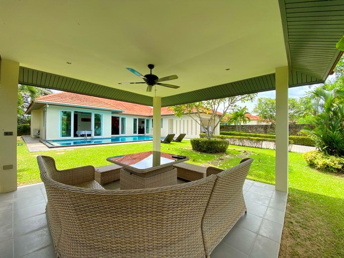 House for sale Mabprachan Pattaya showing the covered terrace and garden 