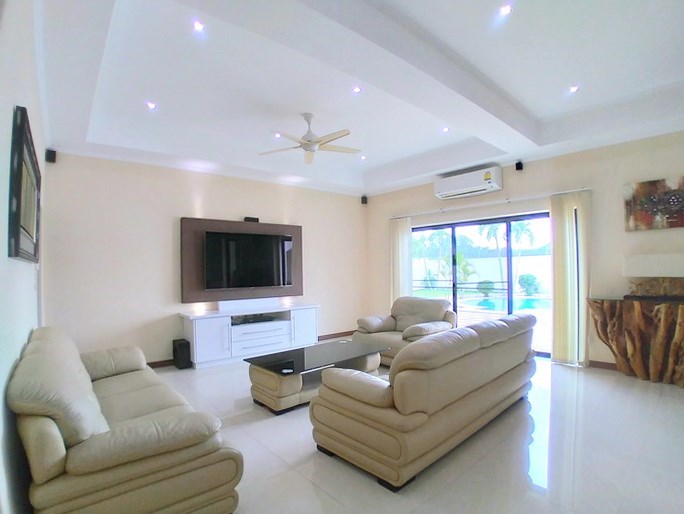 House for sale Mabprachan Pattaya showing the living room pool view House for sale Mabprachan Pattaya showing the living room pool view