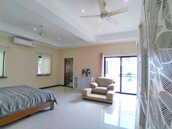 House for sale Mabprachan Pattaya showing the master bedroom with pool view House for sale Mabprachan Pattaya showing the master bedroom with pool view