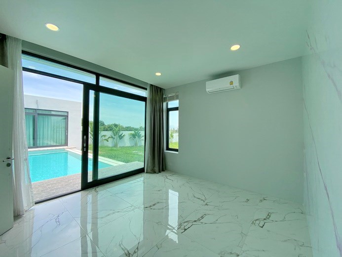 House for sale Mabprachan Pattaya showing the second bedroom with pool view 