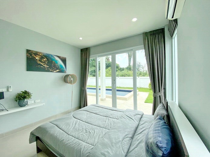 House for sale Na Jomtien showing the second bedroom pool view 