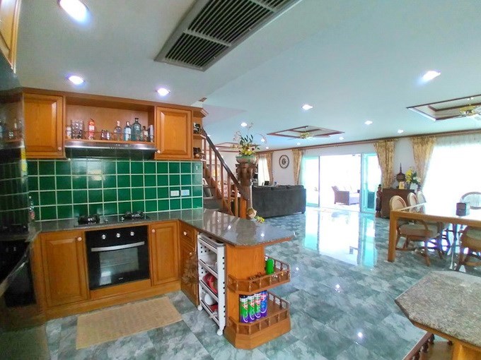 House for sale Pattaya showing the kitchen, dining and living areas 