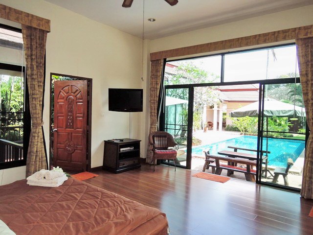 House for sale Pattaya showing the master bedroom poolside