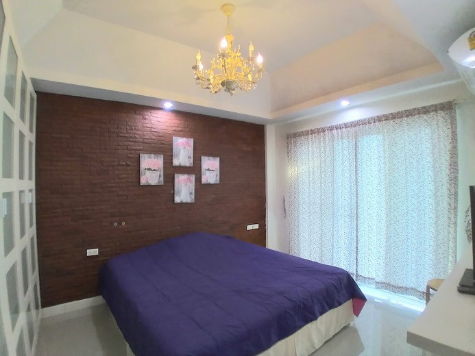 House for sale Pattaya showing the second bedroom and balcony  