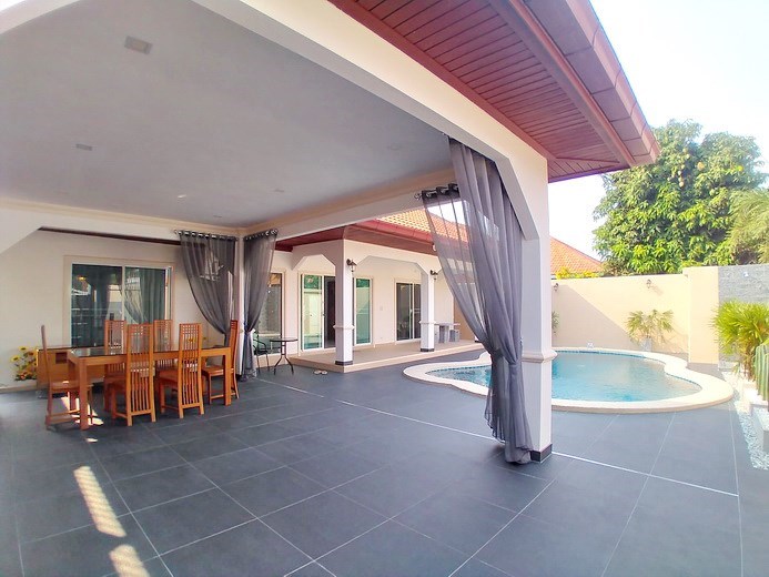 House for sale South Pattaya showing the covered terrace and pool
