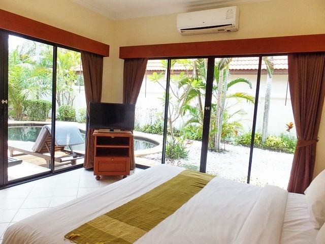 House for sale View Talay Villas Jomtien showing the second bedroom with pool view 