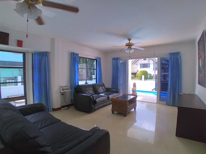 House for sale East Pattaya showing the living room pool view House for sale East Pattaya showing the living room pool view