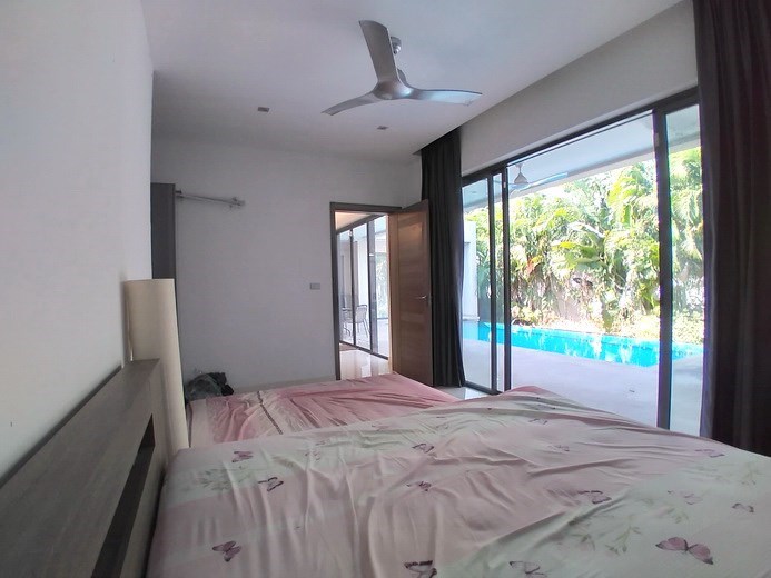 House for sale Mabprachan Pattaya showing the master bedroom pool view House for sale Mabprachan Pattaya showing the master bedroom pool view