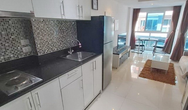 Condominium for rent Pattaya showing the kitchen, living and dining areas 