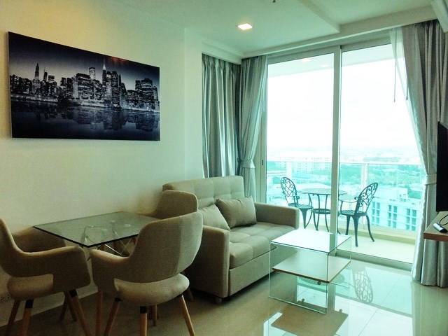 Condominium for rent Pattaya showing the living, dining areas and balcony 
