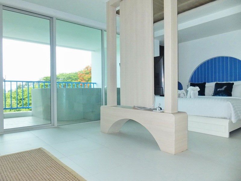 Condominium for sale Bangsaray Pattaya showing the sleeping area and balcony 