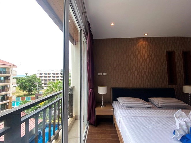 Condominium for sale Jomtien showing the master bedroom with pool view 