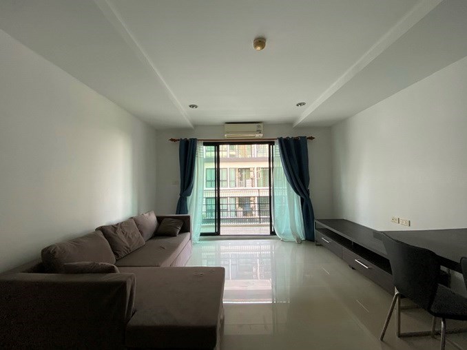 Condominium for sale Pattaya showing the living room and balcony 