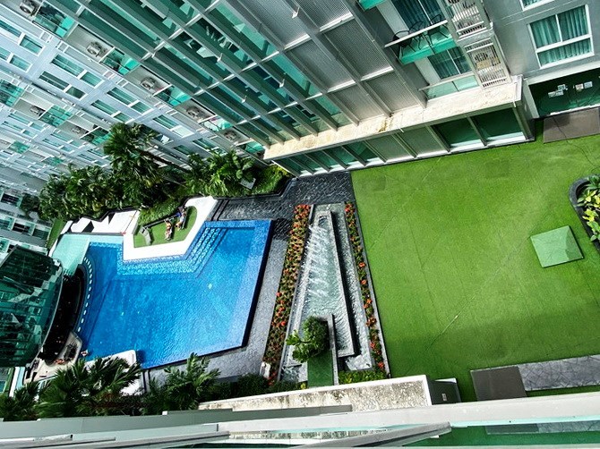 Condominium for sale Pattaya showing the balcony with pool view 