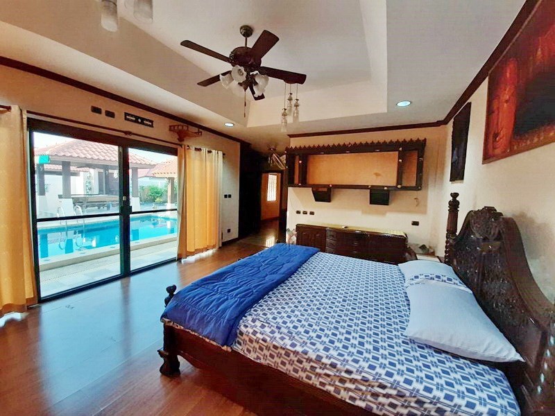 House for sale Huai Yai Pattaya showing the master bedroom with pool view 